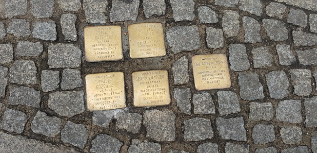 Stumbling Stones with names of Nazi victims in the pavement in Berlin.
