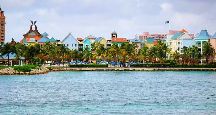 Colorful houses on the water in the Bahamas.