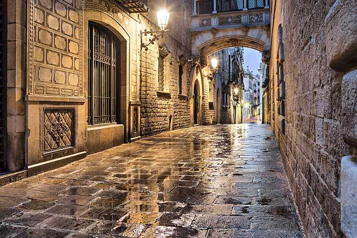 Narrow street in Gothic Quarter of Barcelona.