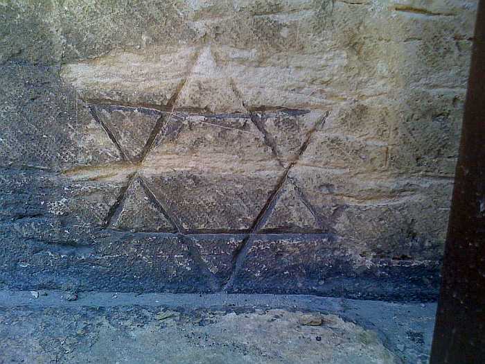 Star of David graffiti in Lisbon's Jewish quarter.