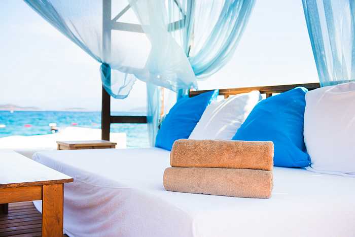 Cabana by sea at luxury resort.