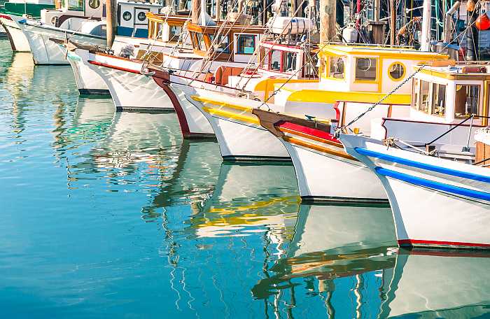 Colorful sail boats at Fisherman's Wharf in San Francisco.